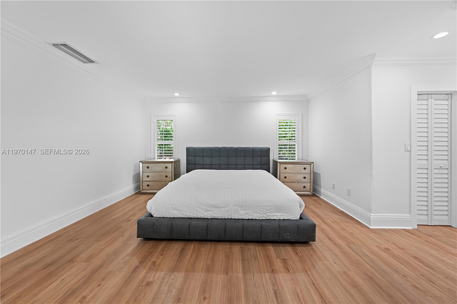 8801 Southwest 124th Street Miami, FL 33176 - Photo 21 of 48 a large bed sitting in a bedroom next to a window