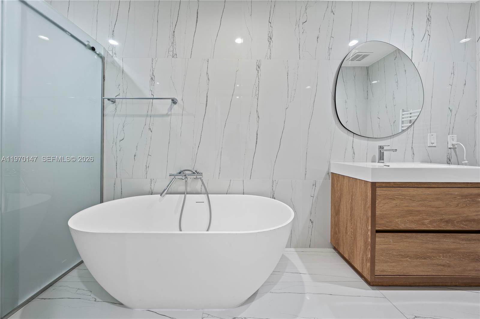 8801 Southwest 124th Street Miami, FL 33176 - Photo 25 of 48 a bathroom with a bathtub and a sink