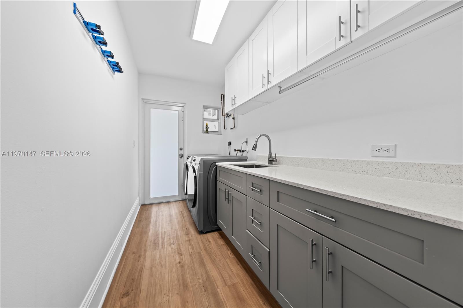 8801 Southwest 124th Street Miami, FL 33176 - Photo 27 of 48 a kitchen with a sink and wooden floor