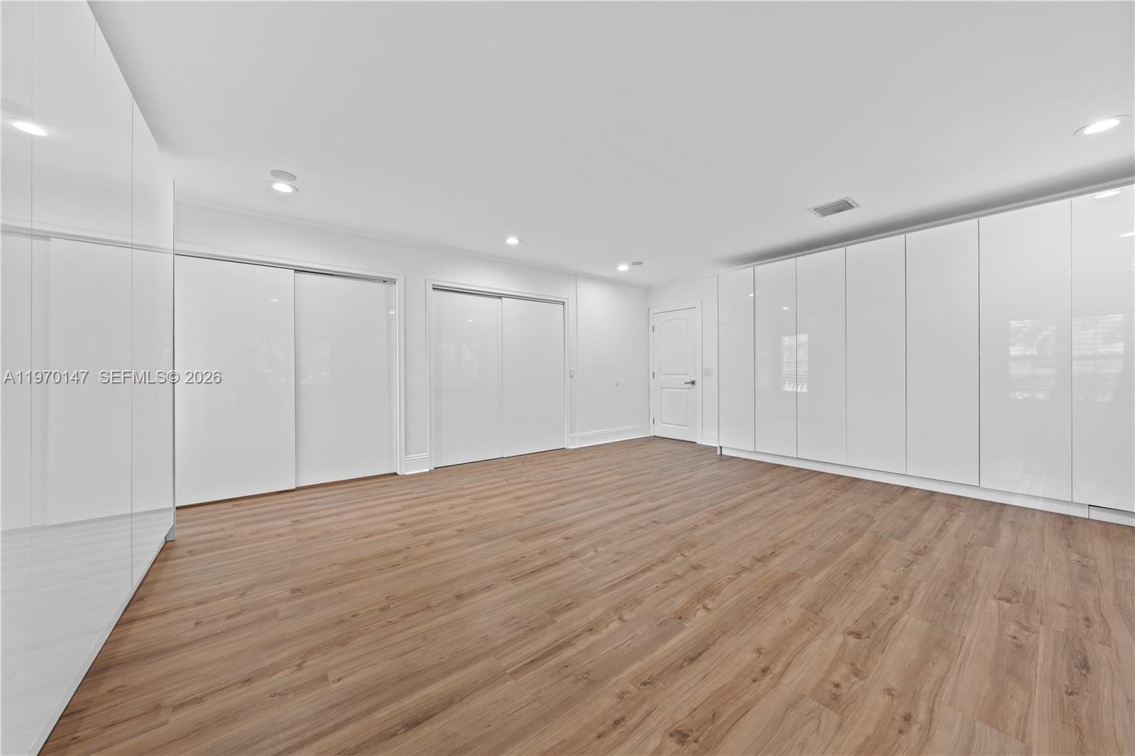8801 Southwest 124th Street Miami, FL 33176 - Photo 29 of 48 a view of an empty room with wooden floor