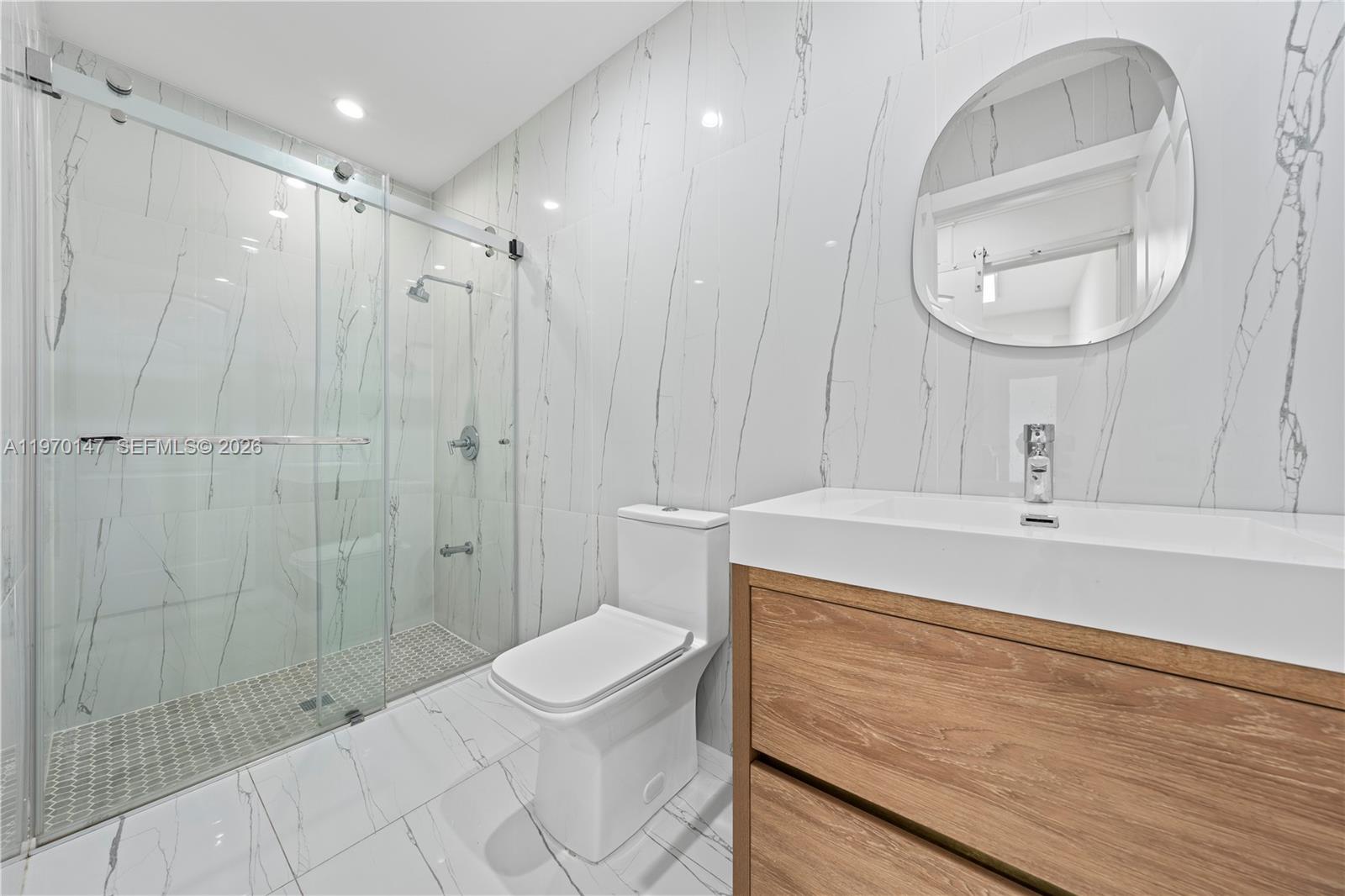 8801 Southwest 124th Street Miami, FL 33176 - Photo 31 of 48 a bathroom with a sink a toilet and shower