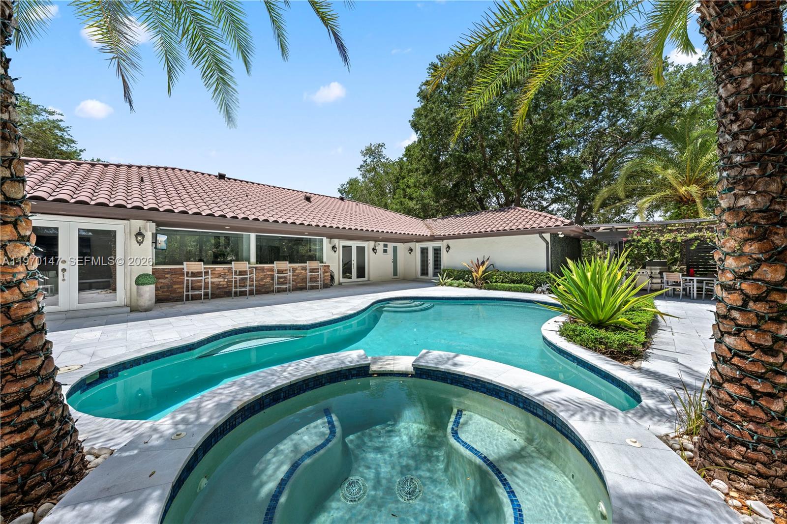 8801 Southwest 124th Street Miami, FL 33176 - Photo 35 of 48 a view of a house with a swimming pool