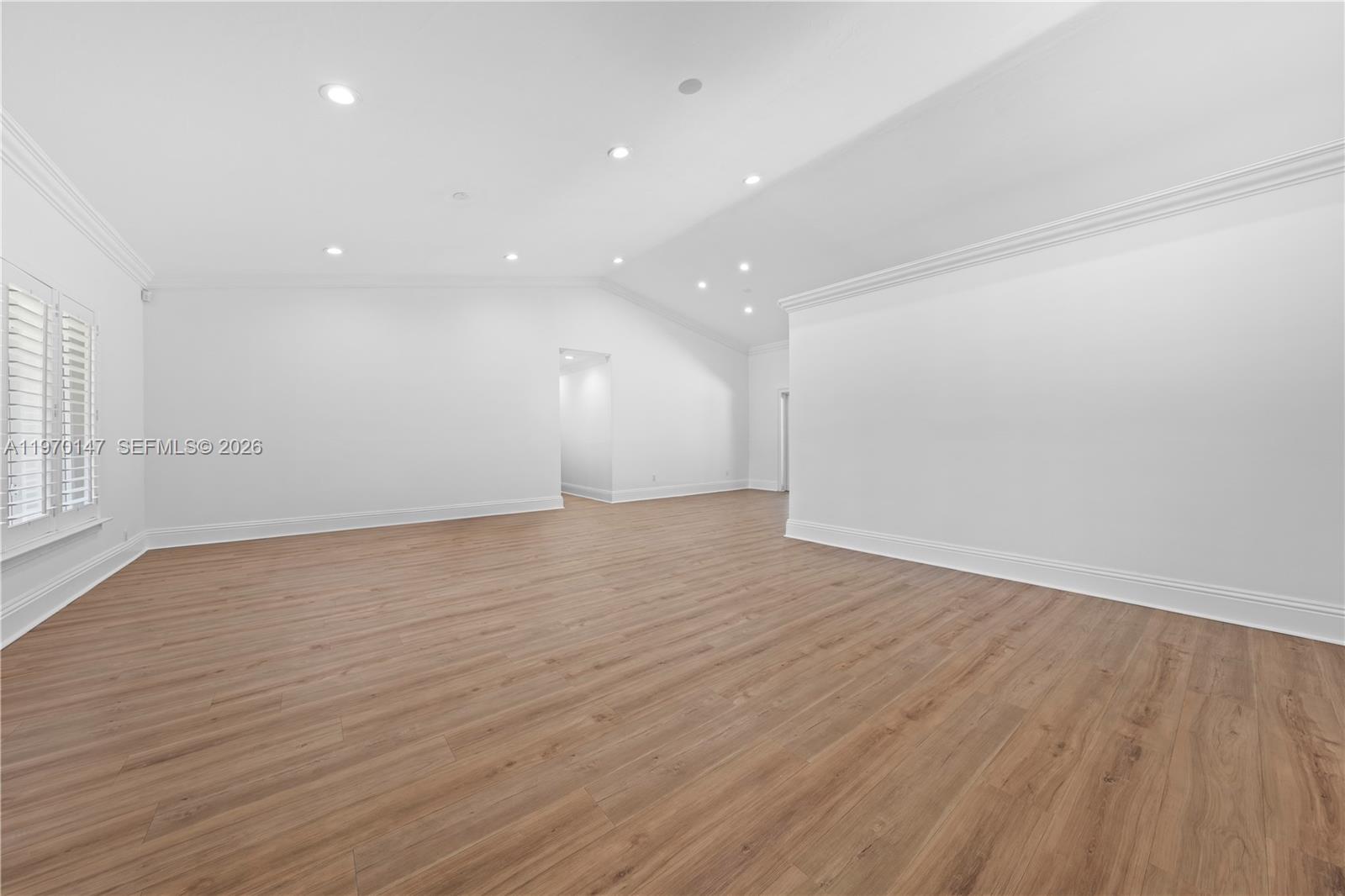 8801 Southwest 124th Street Miami, FL 33176 - Photo 6 of 48 an empty room with wooden floor and windows