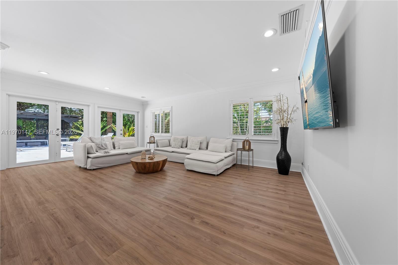 8801 Southwest 124th Street Miami, FL 33176 - Photo 8 of 48 a living room with furniture and a large window