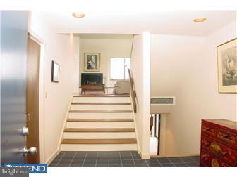 80 Province Line Road Skillman, NJ 08558 - Photo 2 of 12 a view of a hallway with wooden floor and staircase
