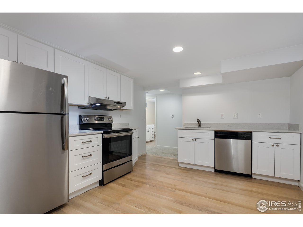 870 15th Street Boulder, CO 80302 - Photo 21 of 40 Lower level kitchen with quartz countertops and hardwoods