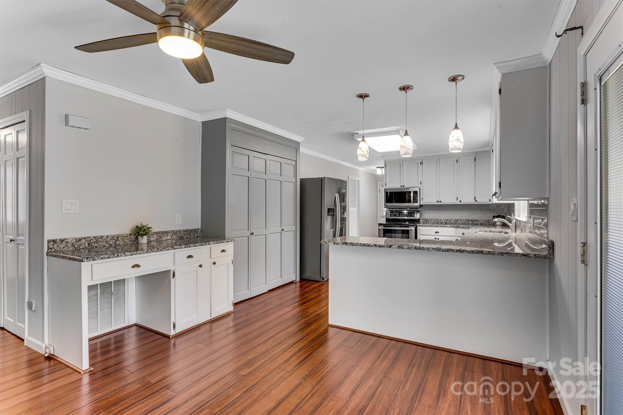 4015 Highway 18 Vale, NC 28168 - Photo 13 of 45 a kitchen with stainless steel appliances a stove top oven a sink cabinets and wooden floor