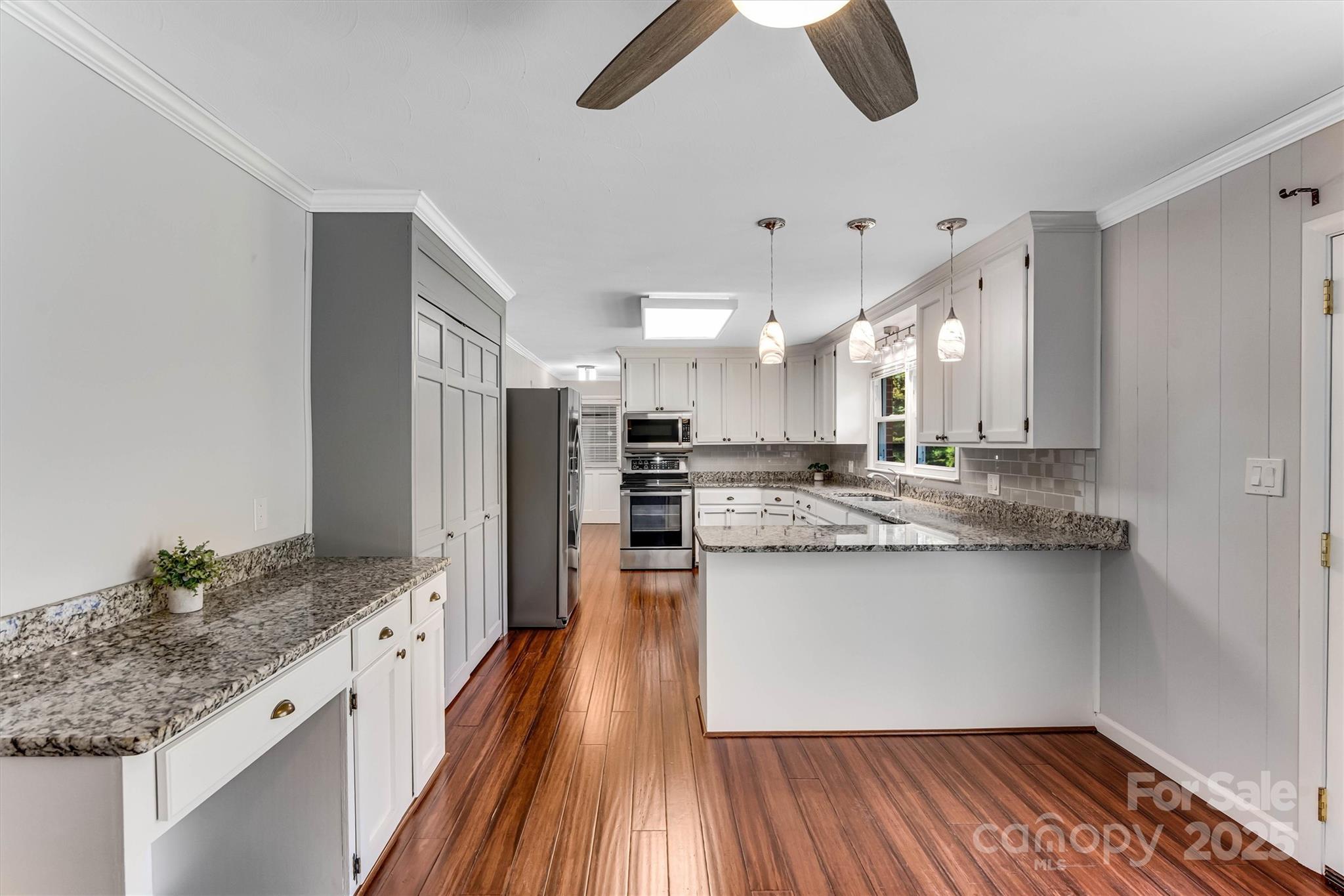 4015 Highway 18 Vale, NC 28168 - Photo 16 of 45 a kitchen with stainless steel appliances granite countertop a sink stove and refrigerator