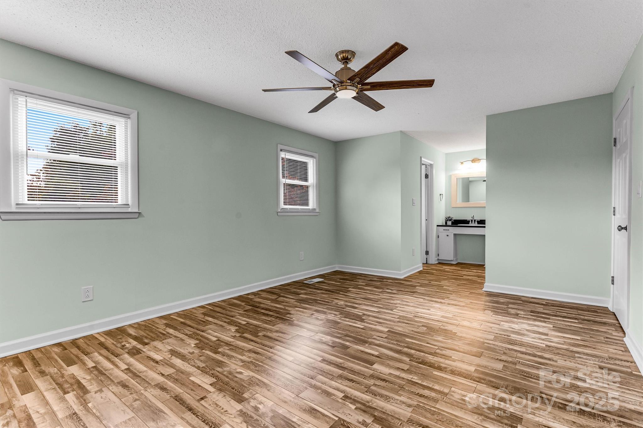 4015 Highway 18 Vale, NC 28168 - Photo 22 of 45 a view of empty room with wooden floor and ceiling fan