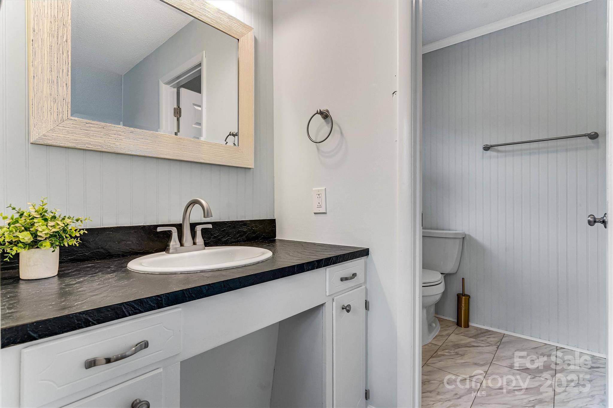 4015 Highway 18 Vale, NC 28168 - Photo 24 of 45 a bathroom with a granite countertop sink and a mirror