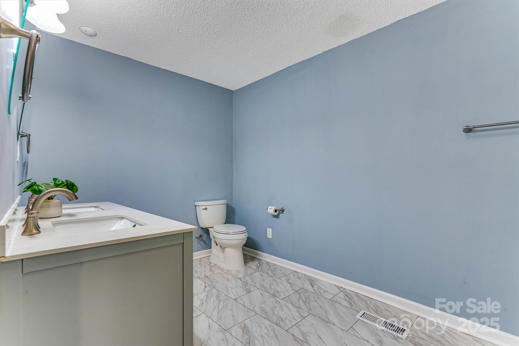 4015 Highway 18 Vale, NC 28168 - Photo 27 of 45 a bathroom with a white toilet and a sink
