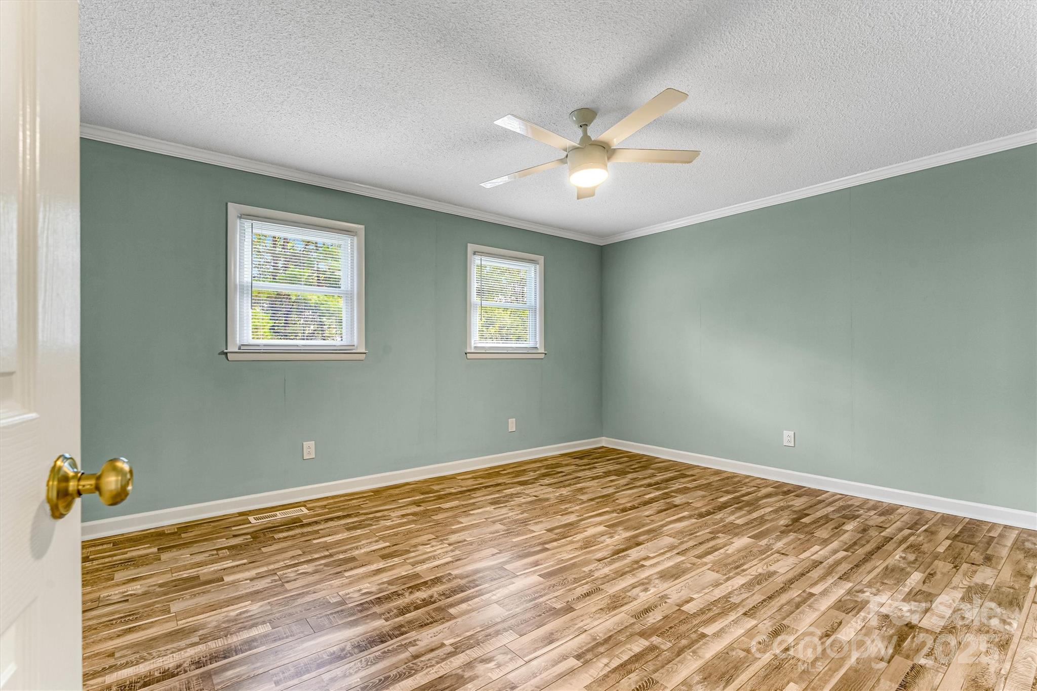4015 Highway 18 Vale, NC 28168 - Photo 31 of 45 a view of an empty room with window and wooden floor