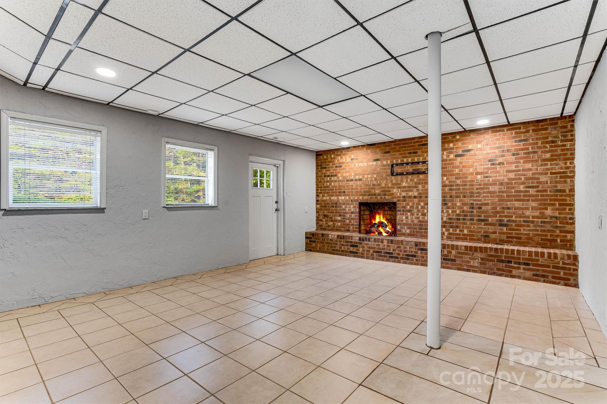 4015 Highway 18 Vale, NC 28168 - Photo 36 of 45 a view of an empty room with a fireplace and a large window