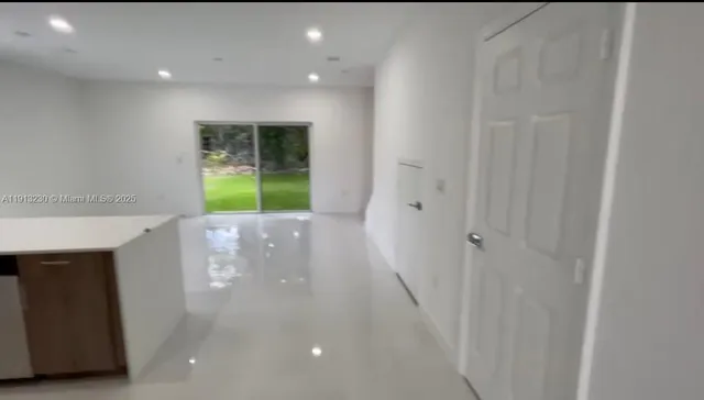 a view of a garden from a windows room