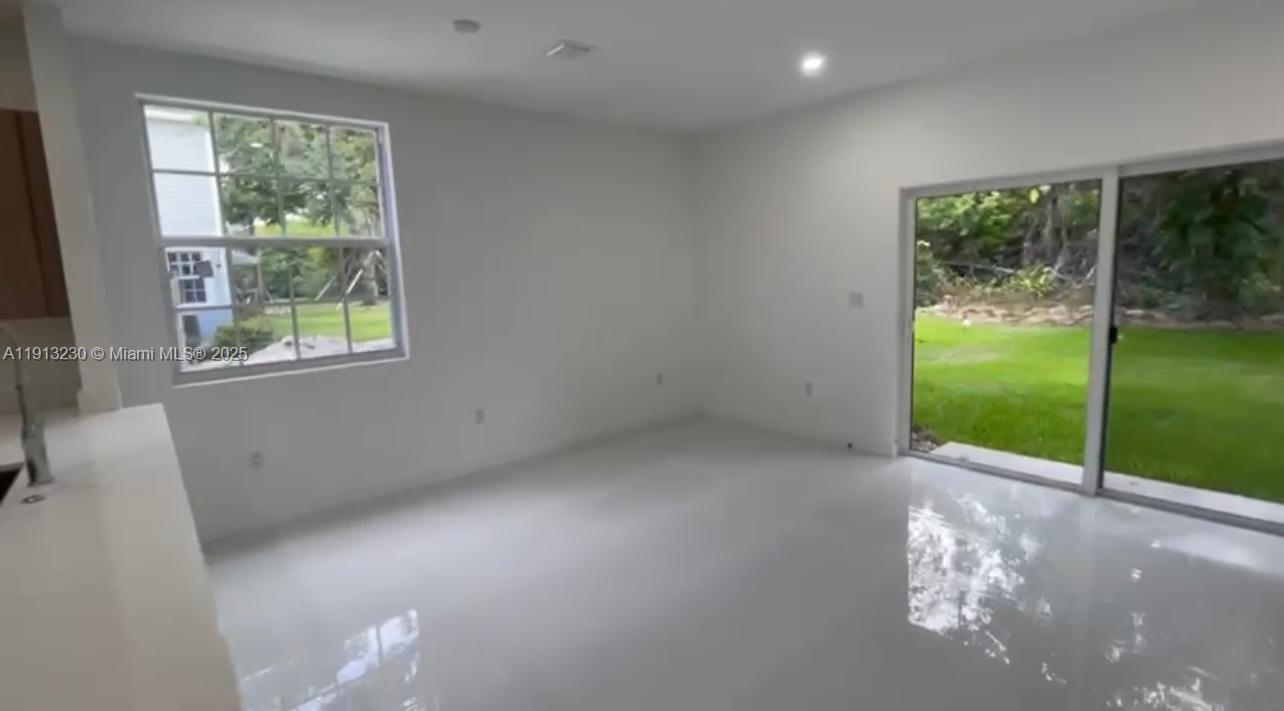 1350 Crystal Way, Unit 101 Delray Beach, FL 33444 - Photo 6 of 13 a view of a garden from a windows room
