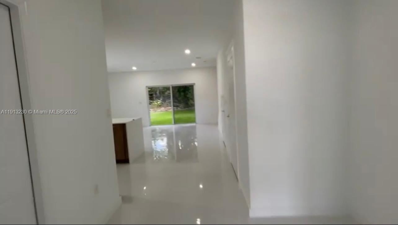 1350 Crystal Way, Unit 101 Delray Beach, FL 33444 - Photo 7 of 13 a view of a hallway