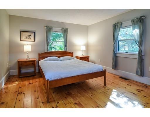 11 Parmenter Road Wayland, MA 01778 - Photo 11 of 29 a bedroom with a bed window and wooden floor