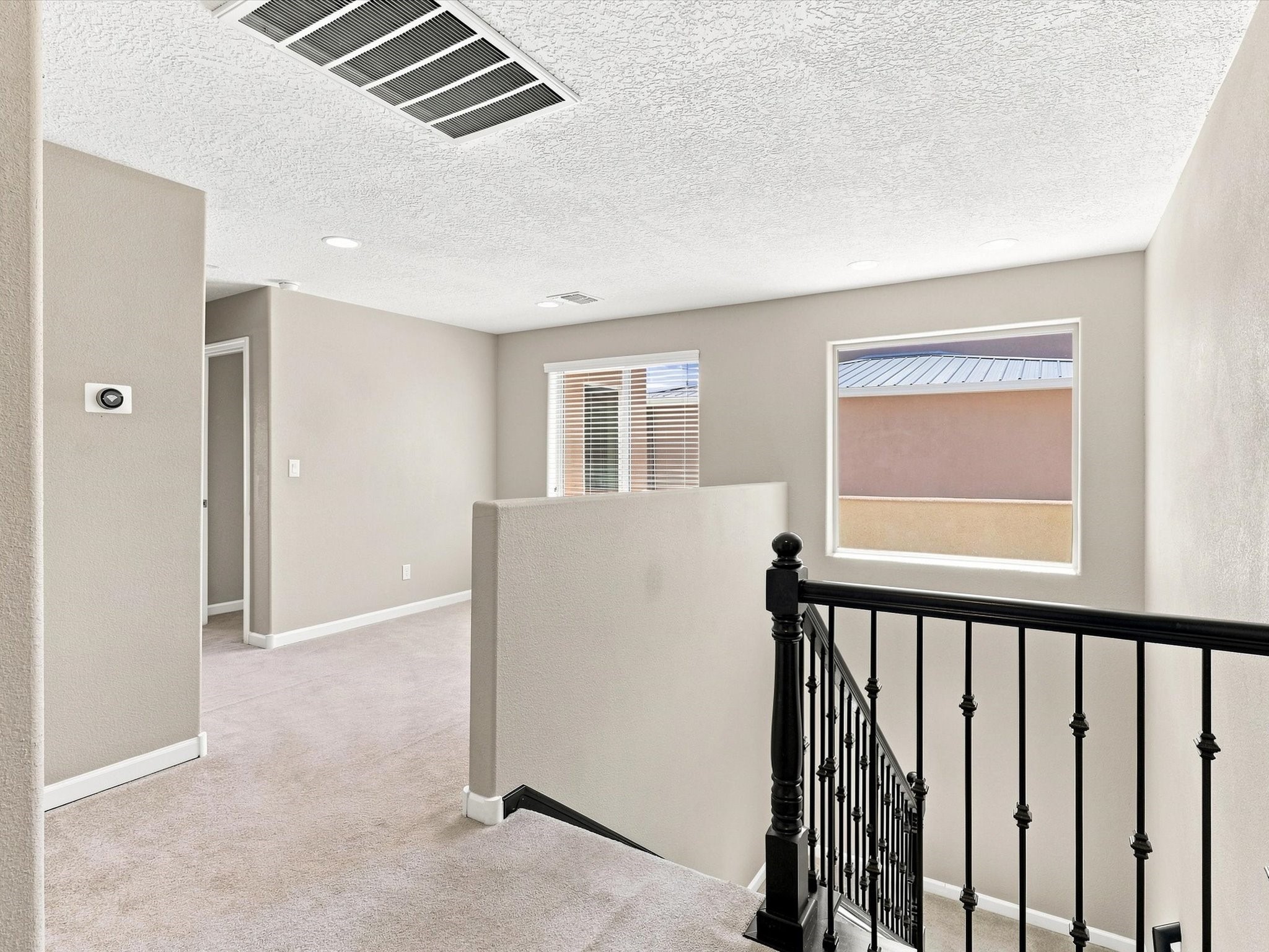 4642 Rail Runner Road Santa Fe, NM 87507 - Photo 32 of 74 Use the upstairs loft as a dedicated mini-office, reading nook, or quiet workspace.