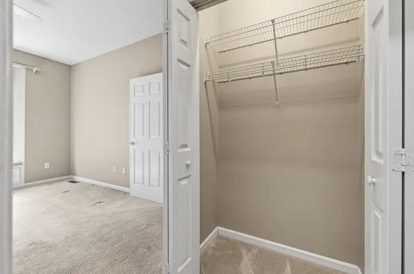 a view of an empty room and fire place