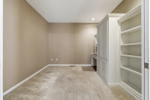 a view of a room with racks on the wall