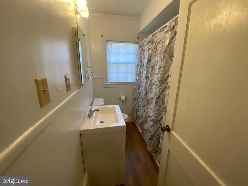 3494 Allen Road Eden, MD 21822 - Photo 23 of 38 a bathroom with a sink a toilet and shower curtain