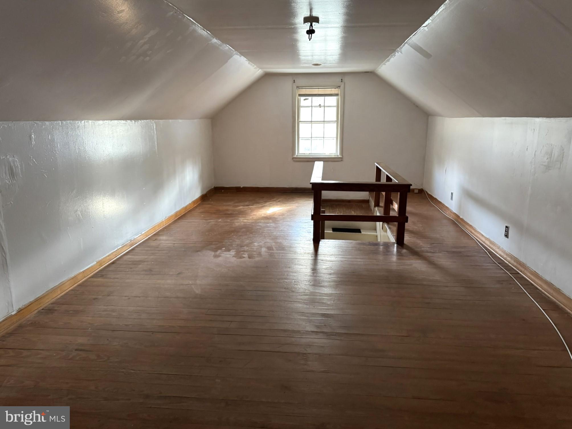 3494 Allen Road Eden, MD 21822 - Photo 34 of 38 an empty room with windows a couch and wooden floor