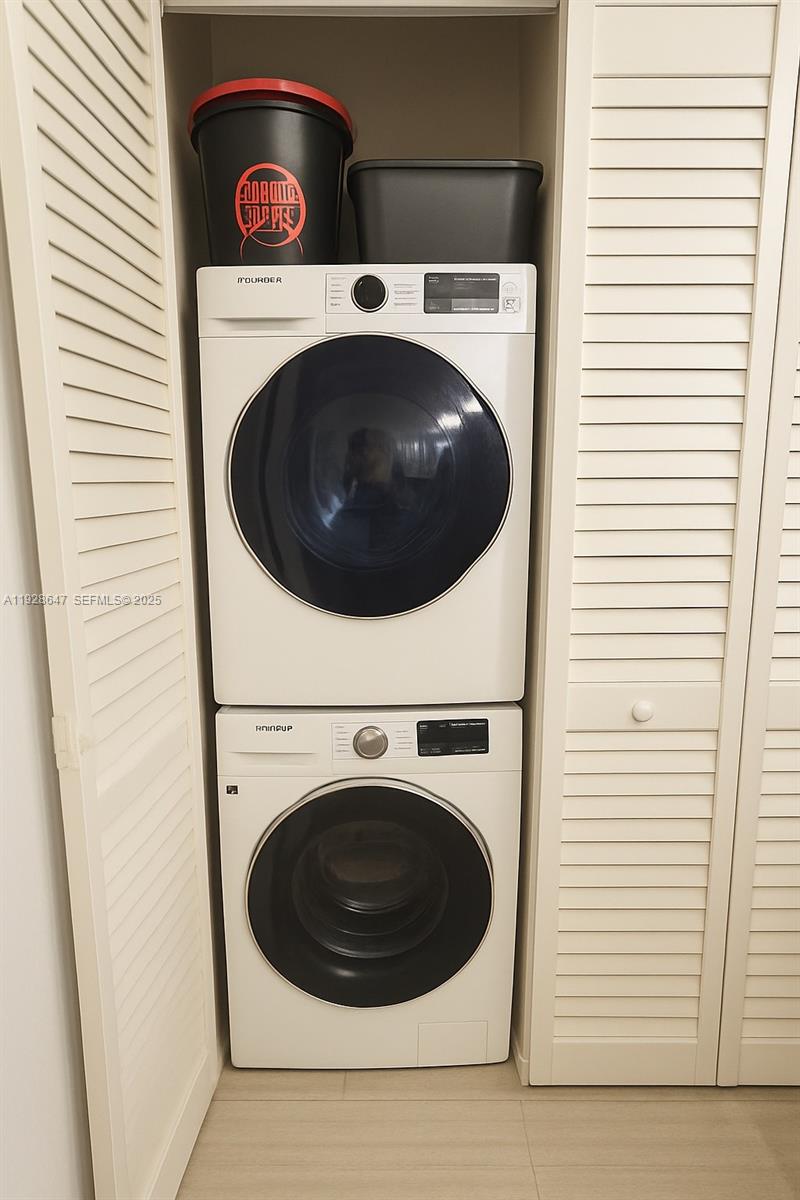 15530 Southwest 80th Street, Unit C301 Miami, FL 33193 - Photo 8 of 8 a utility room with dryer and washer