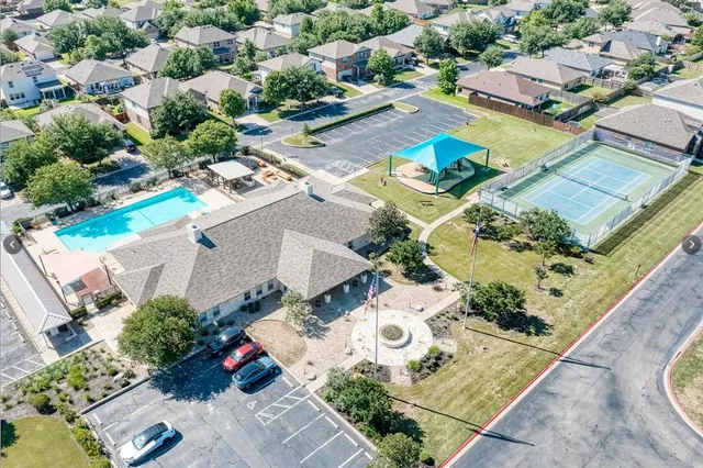a view of a swimming pool with a patio