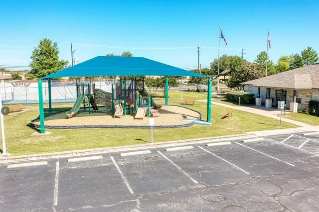 a view of a swimming pool with a lounge chairs