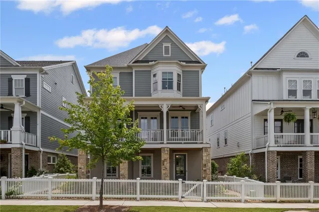 a front view of residential houses with yard