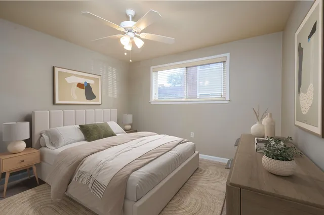 a bedroom with a bed and a potted plant