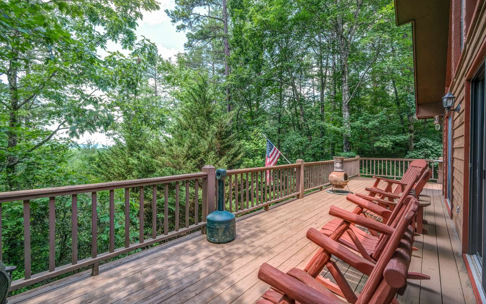 628 Sandy Gap Road Murphy, NC 28906 - Photo 11 of 58 a view of a balcony with wooden floor and outdoor seating