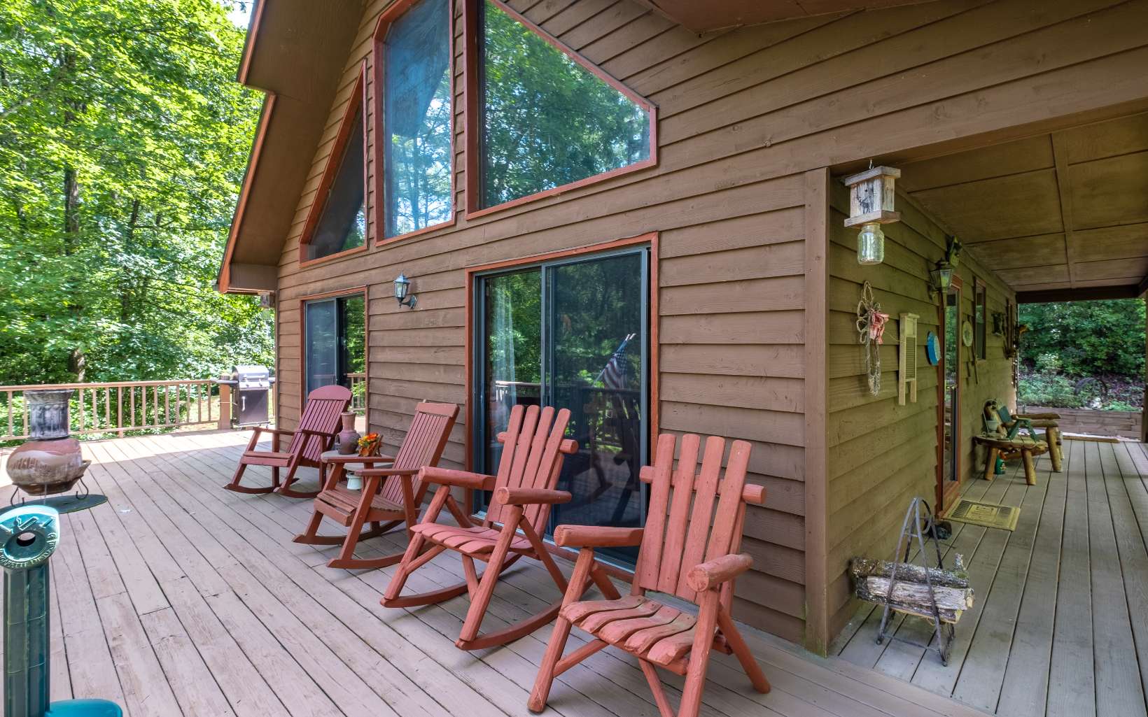628 Sandy Gap Road Murphy, NC 28906 - Photo 13 of 58 a view of a patio with table and chairs and wooden floor