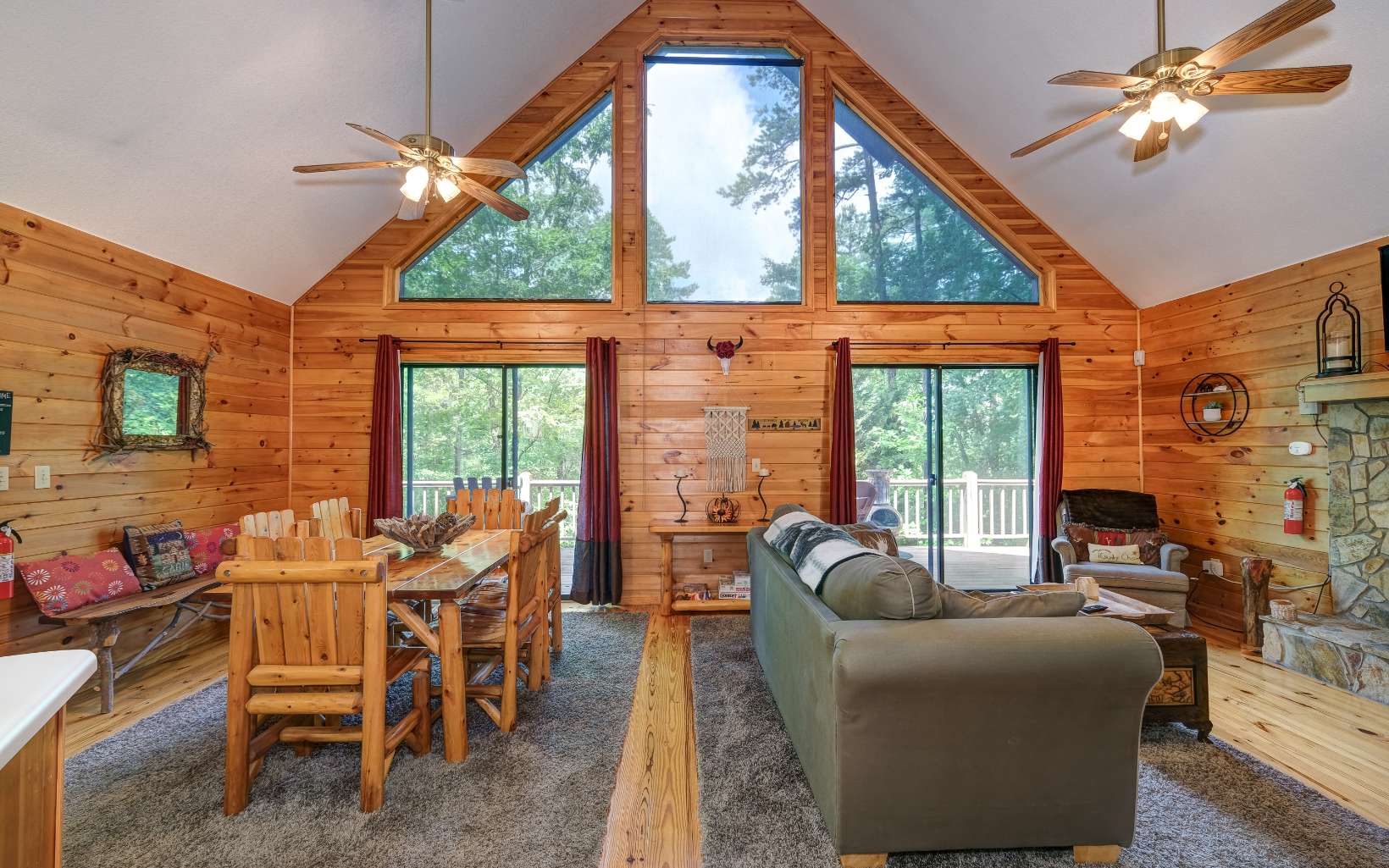 628 Sandy Gap Road Murphy, NC 28906 - Photo 22 of 58 a living room with furniture a fireplace and a floor to ceiling window
