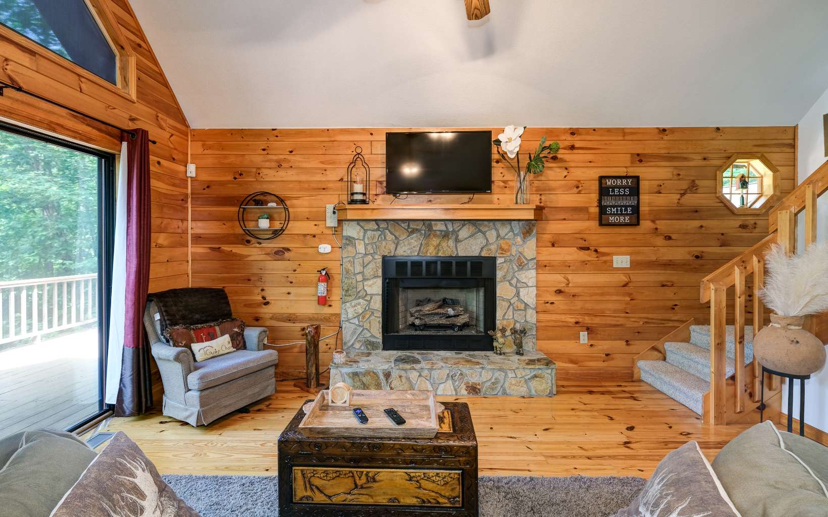628 Sandy Gap Road Murphy, NC 28906 - Photo 23 of 58 a living room with furniture and a fireplace