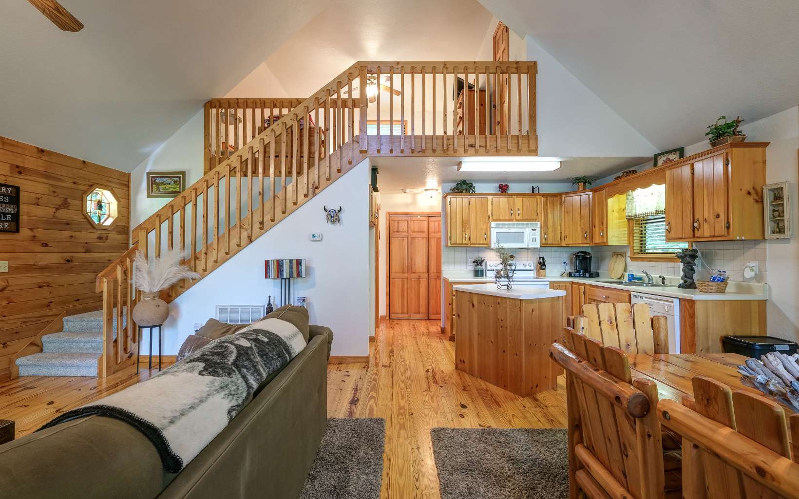 628 Sandy Gap Road Murphy, NC 28906 - Photo 29 of 58 a dinning room with furniture and a kitchen view