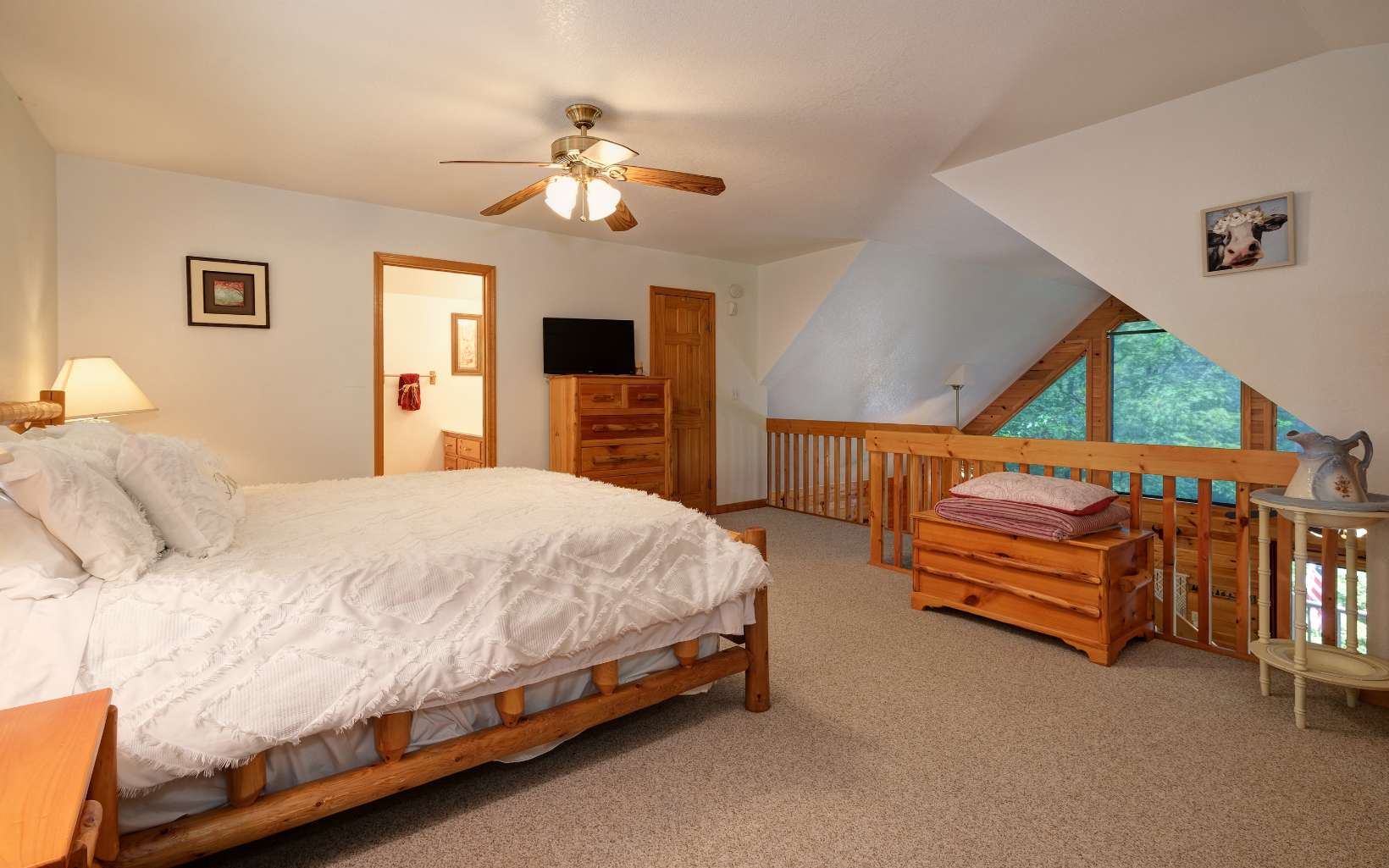 628 Sandy Gap Road Murphy, NC 28906 - Photo 42 of 58 a bedroom with a bed and a chandelier