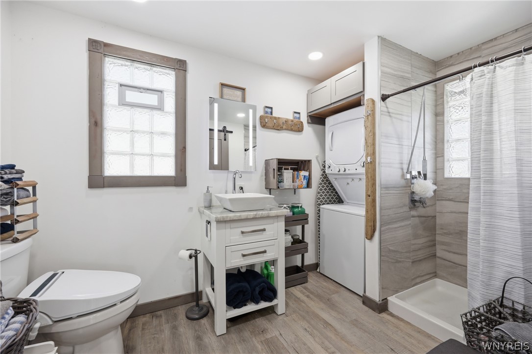 879 Triangle Drive Hanover, NY 14081 - Photo 24 of 45 Beautiful bathroom, laundry space, lighted mirror