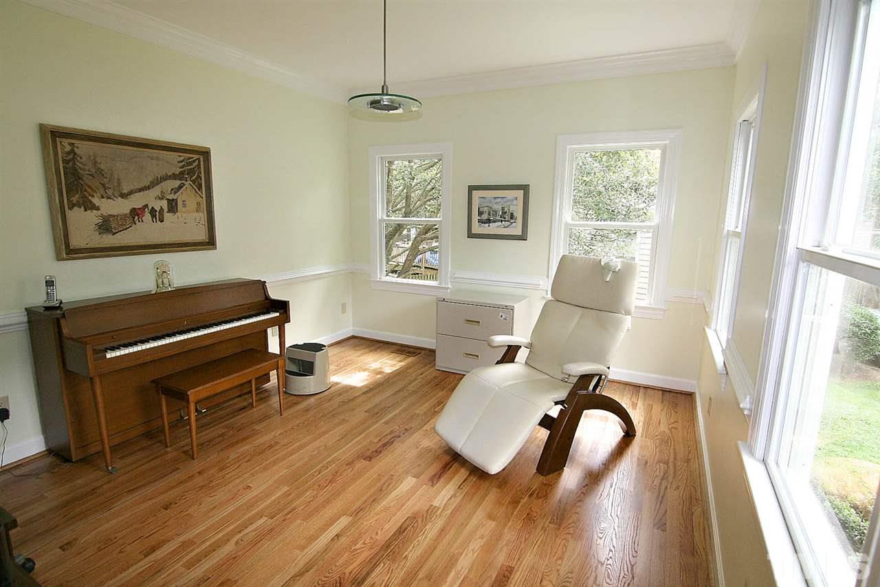 206 Lawrence Road Cary, NC 27511 - Photo 11 of 25 a living room with furniture and a wooden floor