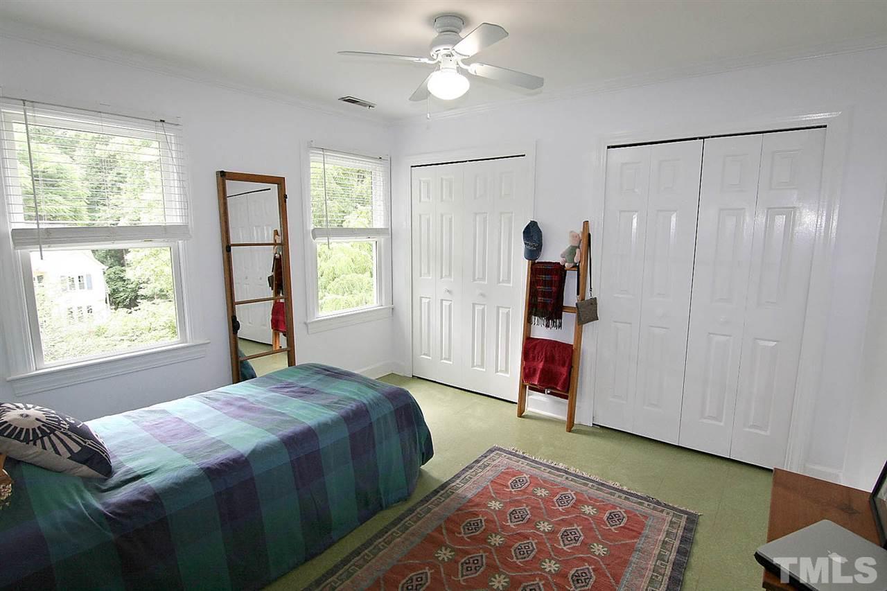 206 Lawrence Road Cary, NC 27511 - Photo 15 of 25 a bedroom with a bed and a window