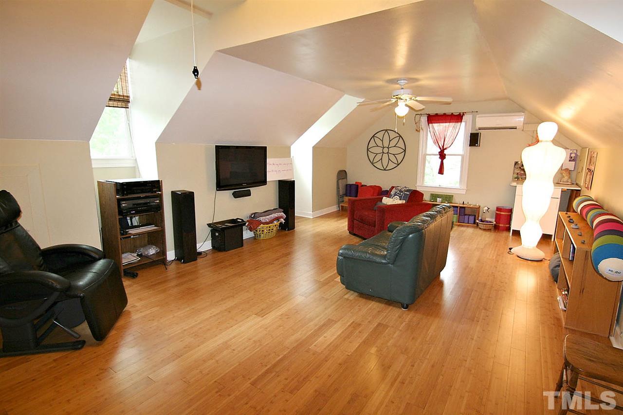 206 Lawrence Road Cary, NC 27511 - Photo 17 of 25 a living room with furniture and a flat screen tv