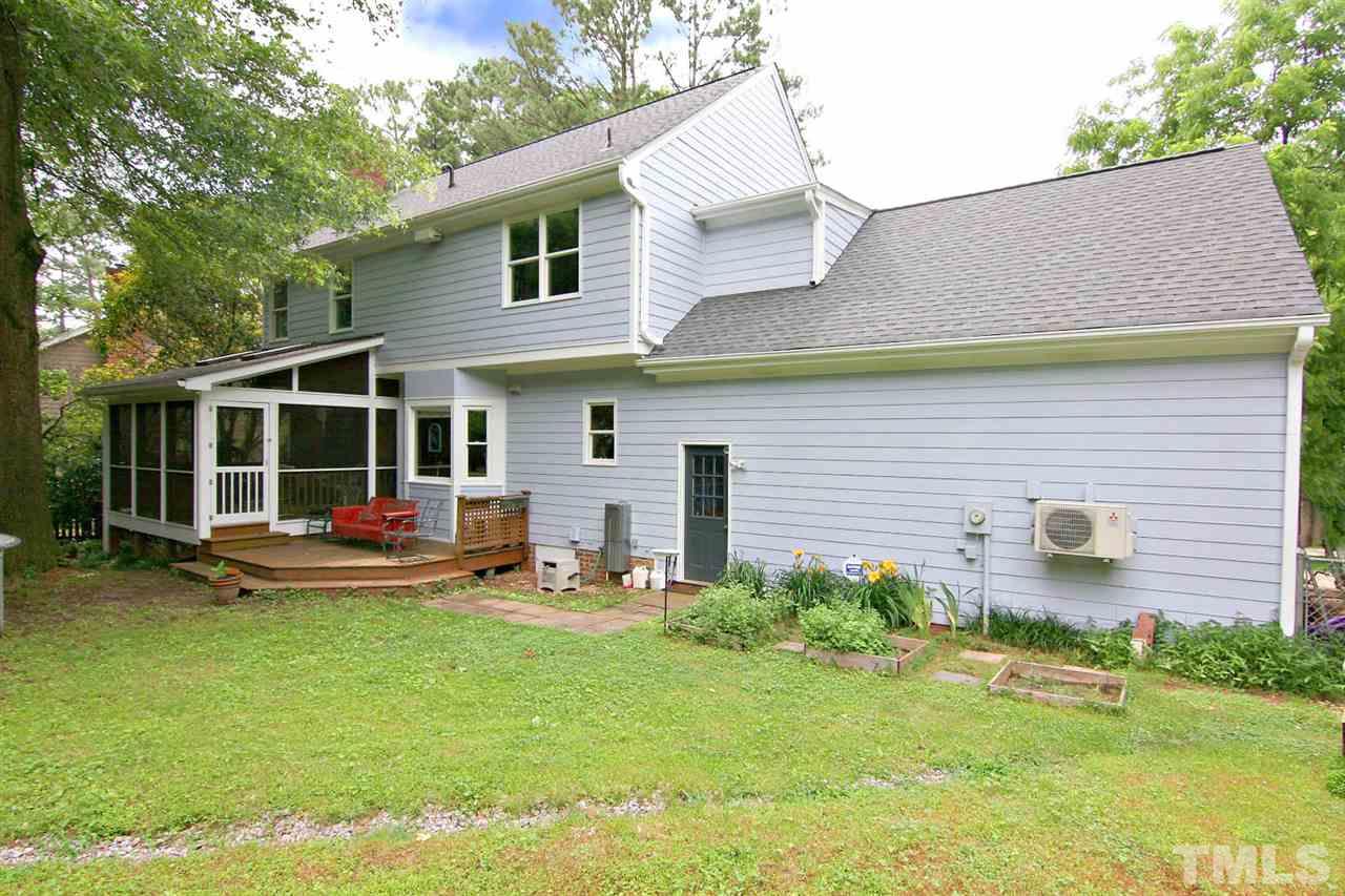 206 Lawrence Road Cary, NC 27511 - Photo 20 of 25 a view of a house with backyard sitting area and garden