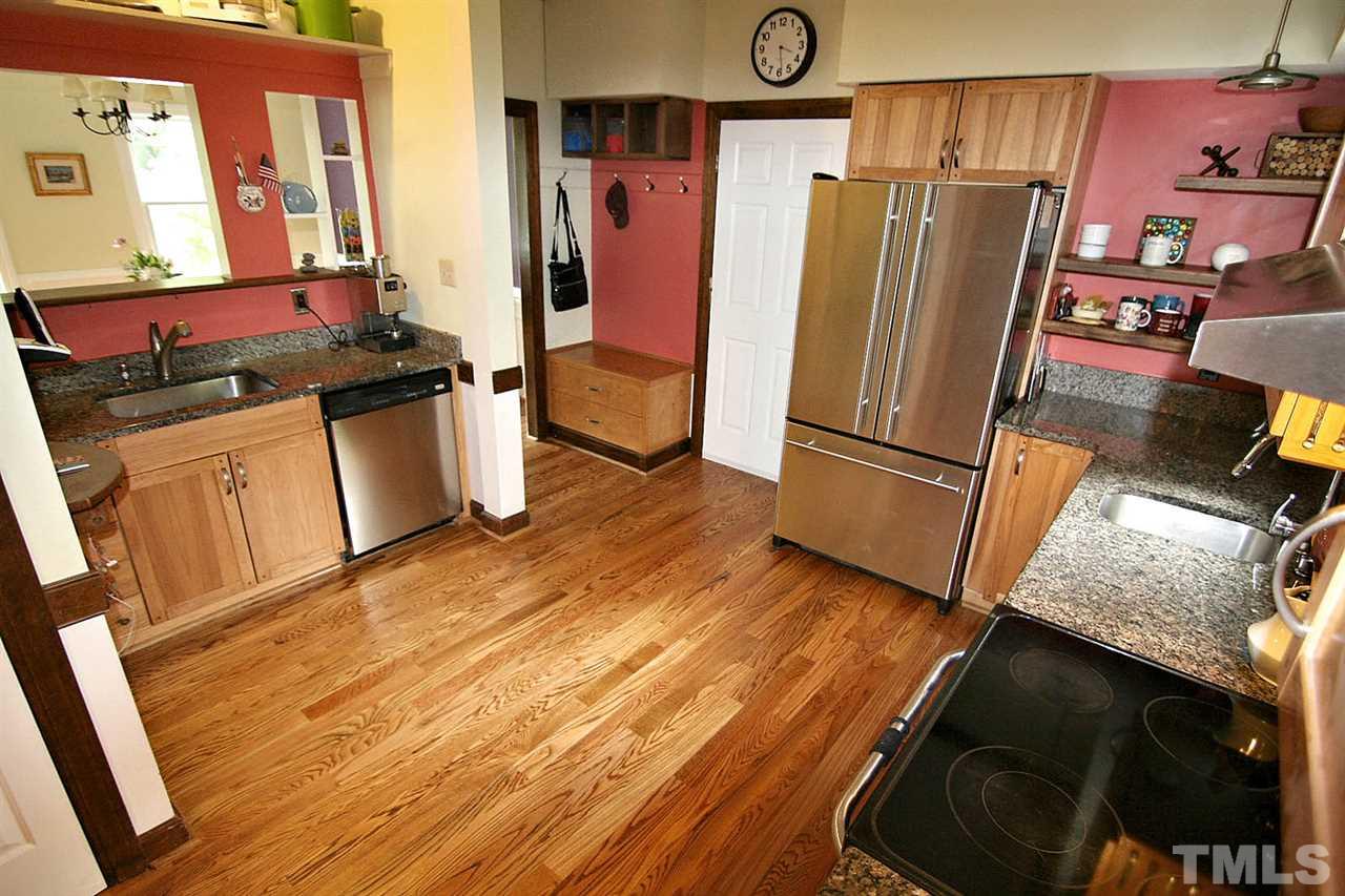 206 Lawrence Road Cary, NC 27511 - Photo 3 of 25 a kitchen with stainless steel appliances granite countertop a refrigerator stove and sink