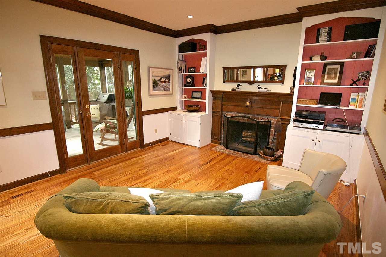 206 Lawrence Road Cary, NC 27511 - Photo 7 of 25 a living room with furniture and a fireplace