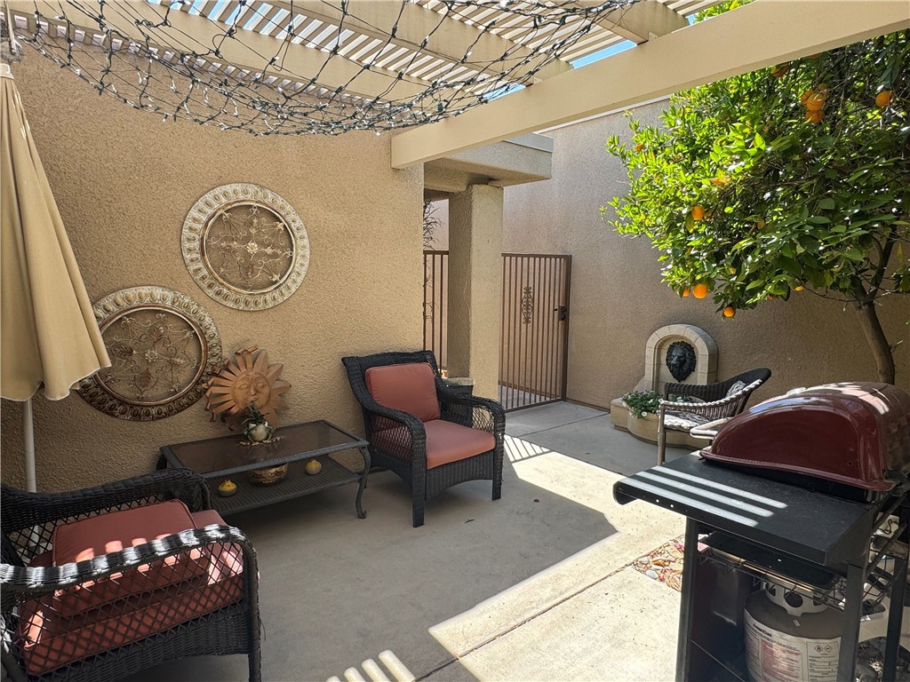 72400 Ridgecrest Lane Palm Desert, CA 92260 - Photo 3 of 13 a living room with furniture and a window