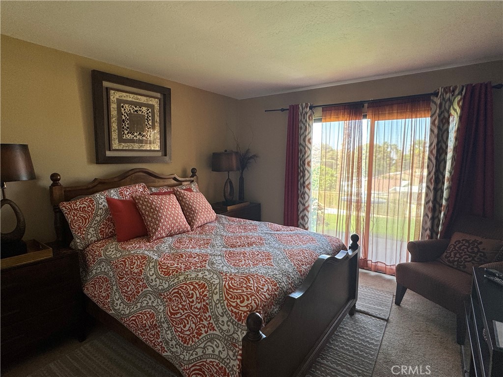 72400 Ridgecrest Lane Palm Desert, CA 92260 - Photo 9 of 13 a bed sitting in a bedroom next to a window