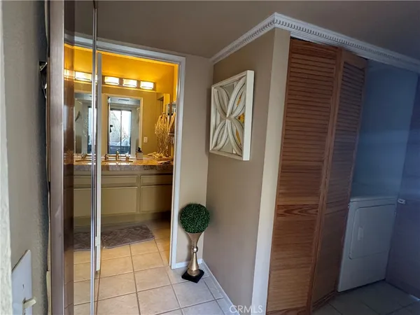 a room with window and a glass door shower