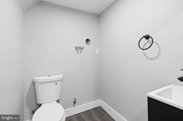 a bathroom with a toilet and a sink