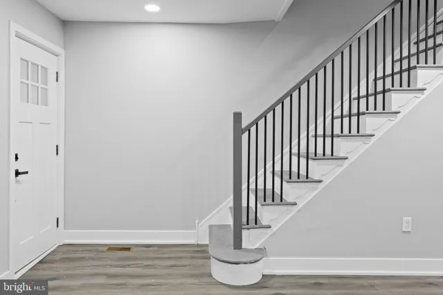 a view of entryway with wooden floor