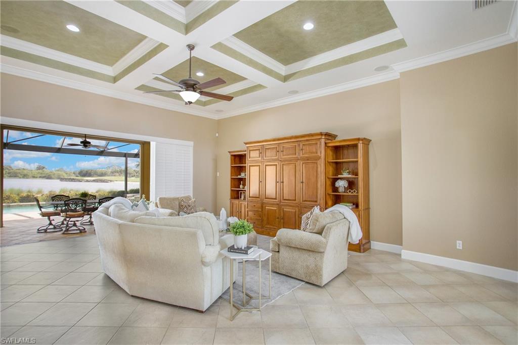 9807 Nickel Ridge Circle Naples, FL 34120 - Photo 19 of 50 a living room with furniture and a large window